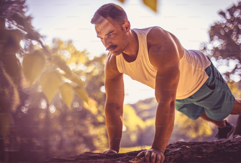 Young man working yoga in the park.