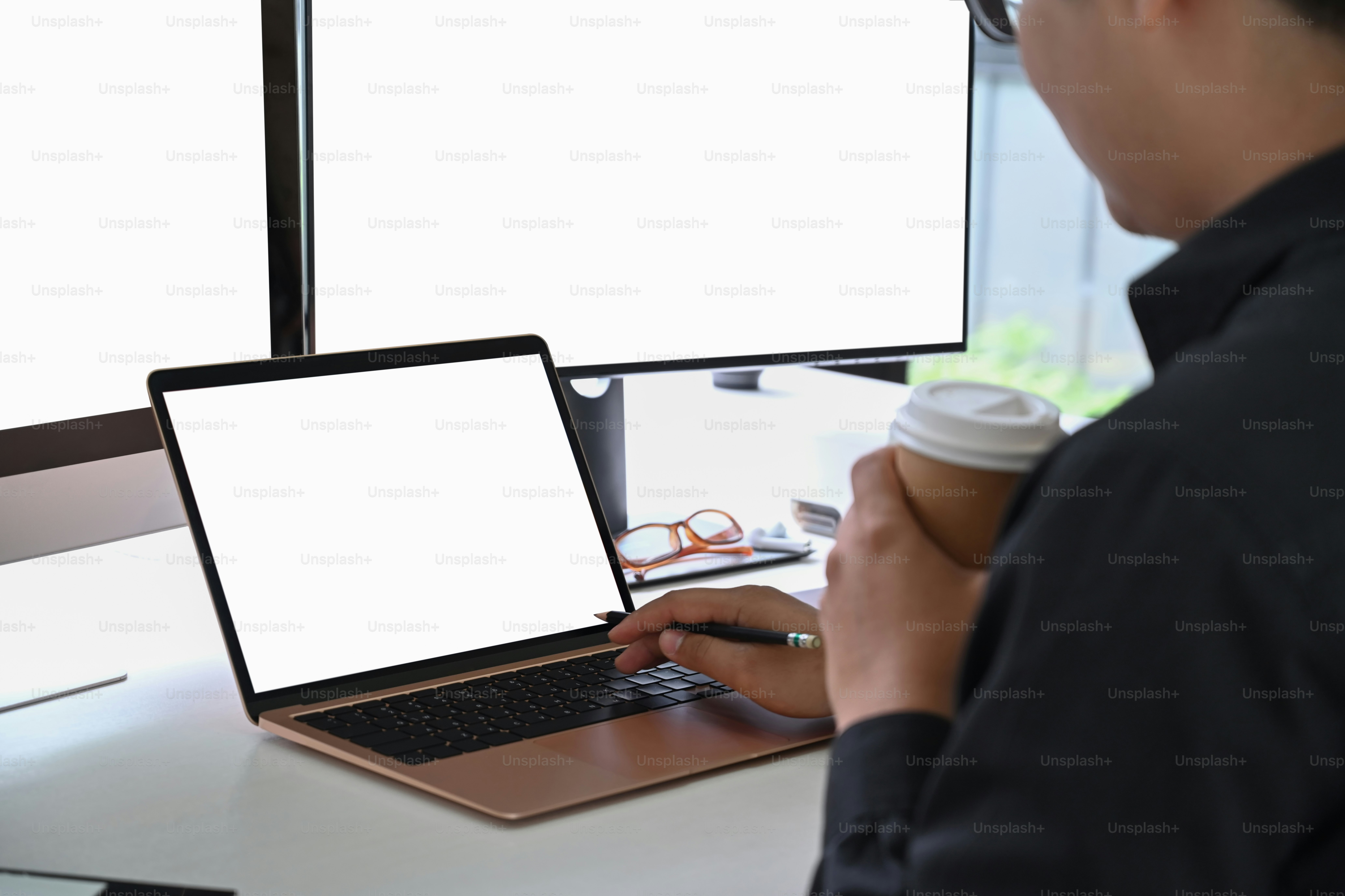 Cropped shot young man programmer working in a software develop company office.