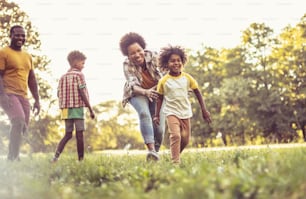 African American family having fun outdoors.