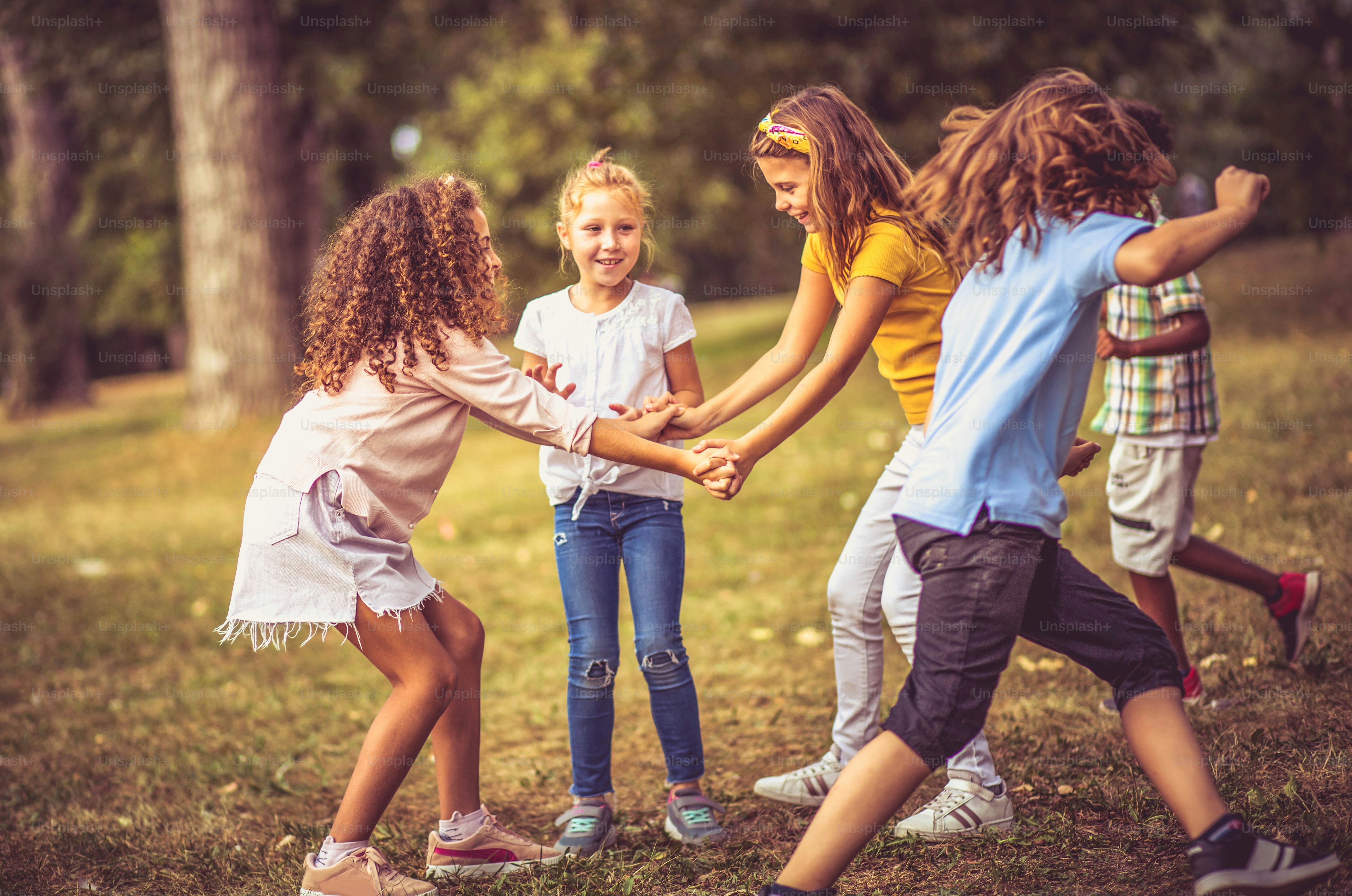 Large group of school kids having fun in nature.