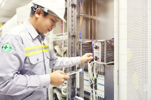 Technician using digital tablet in server room, repair card mainboard checking network link status