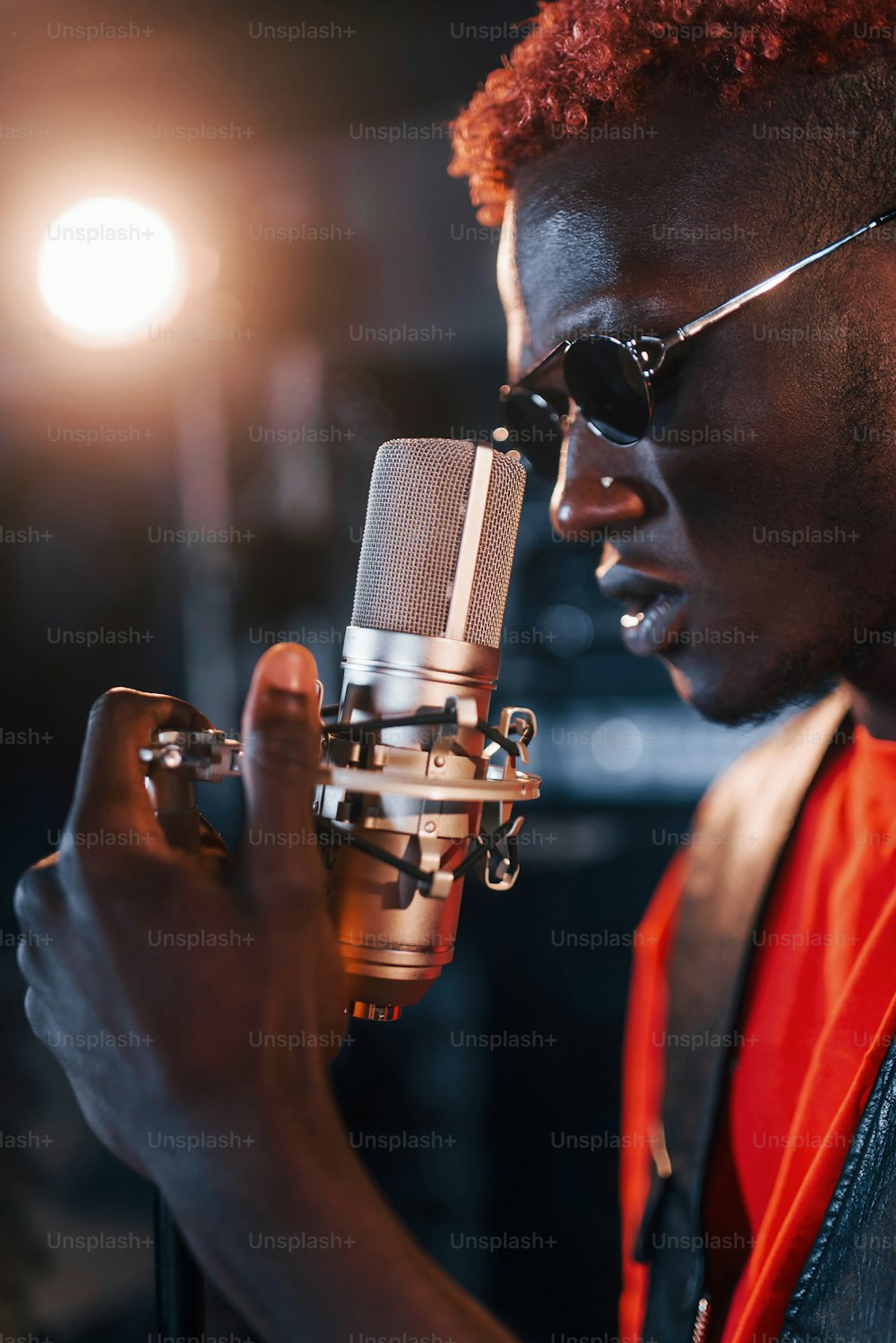 Having vocal practice. Young african american performer rehearsing in a recording studio.