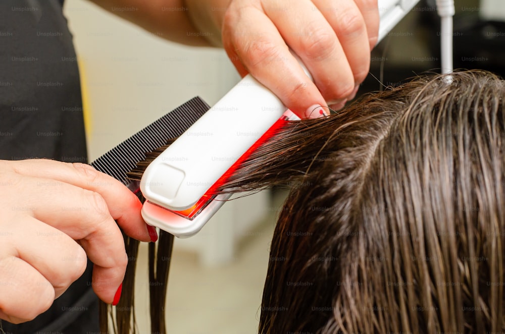 Process of Ultrasonic and Infrared Cold Iron Hair Care Treatment. Damaged hair recovery concept.