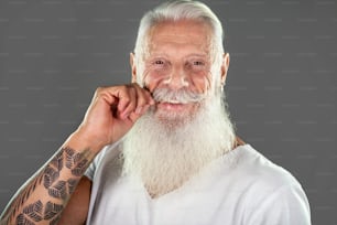 Smiling happy mature bearded man looking at camera. Portrait of handsome confident senior men.