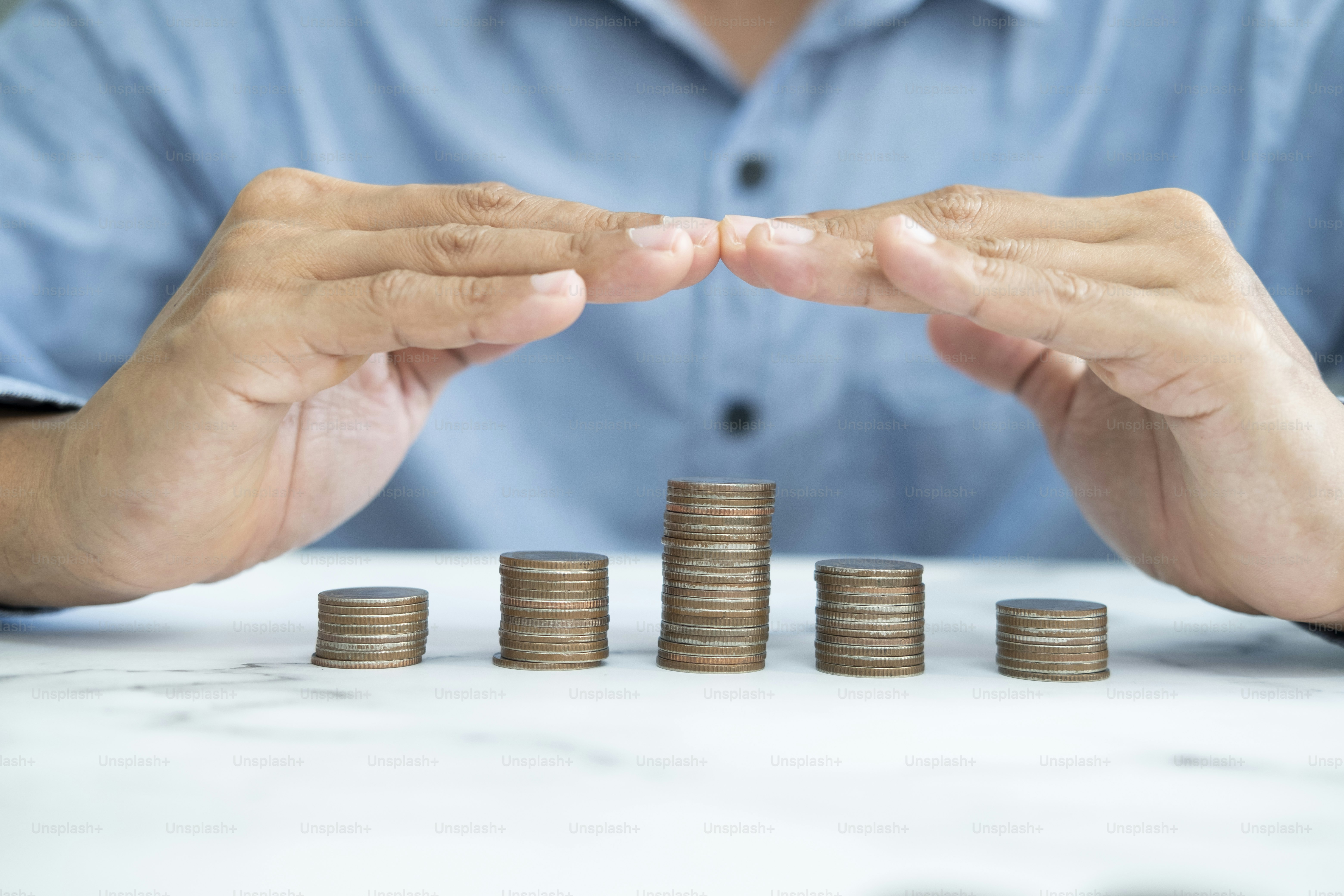 Savings protection, Protect money, Risk management, close up of male hands covering coins