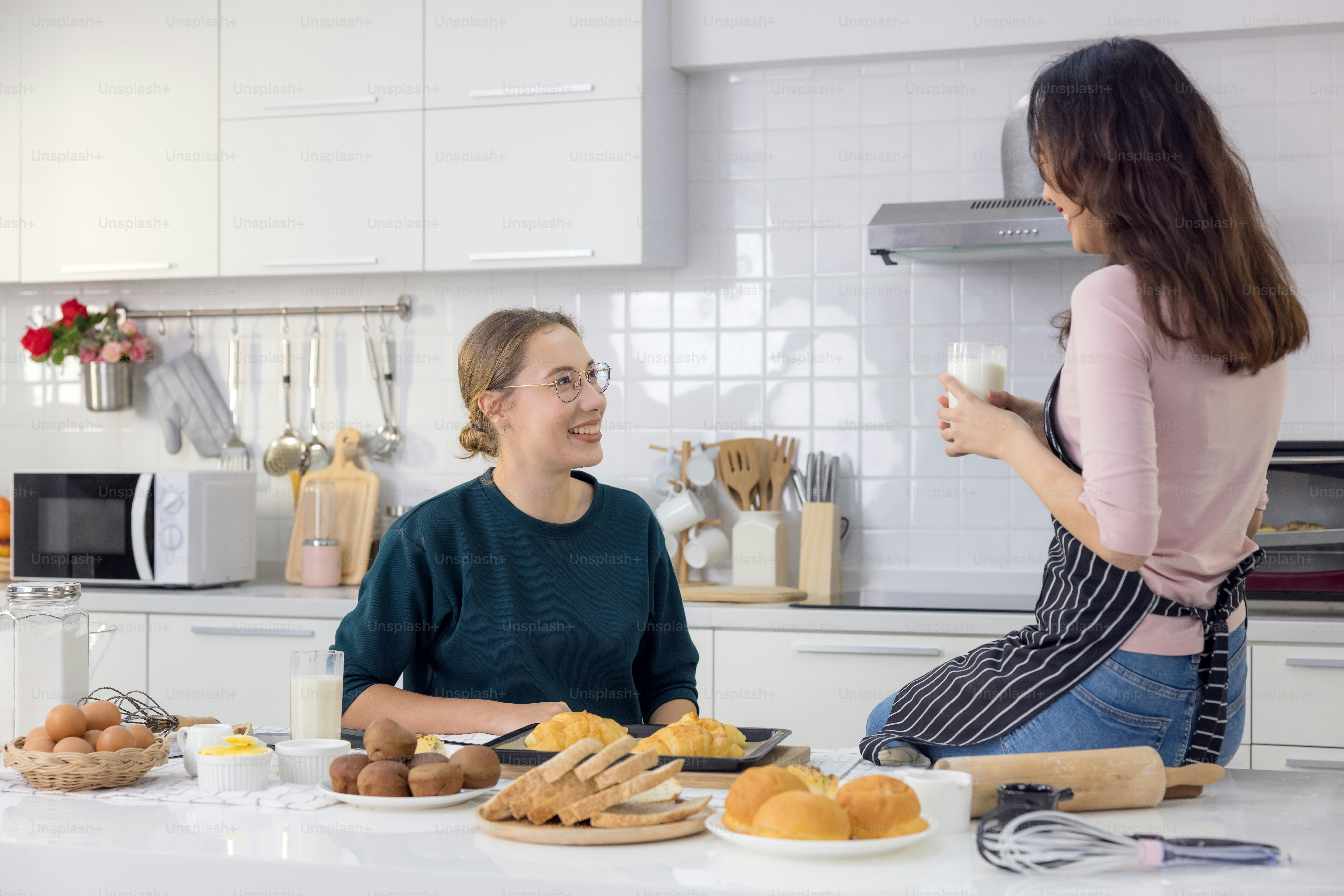 Cute happy two, beautiful baker baking sweets Women had a good time in ...