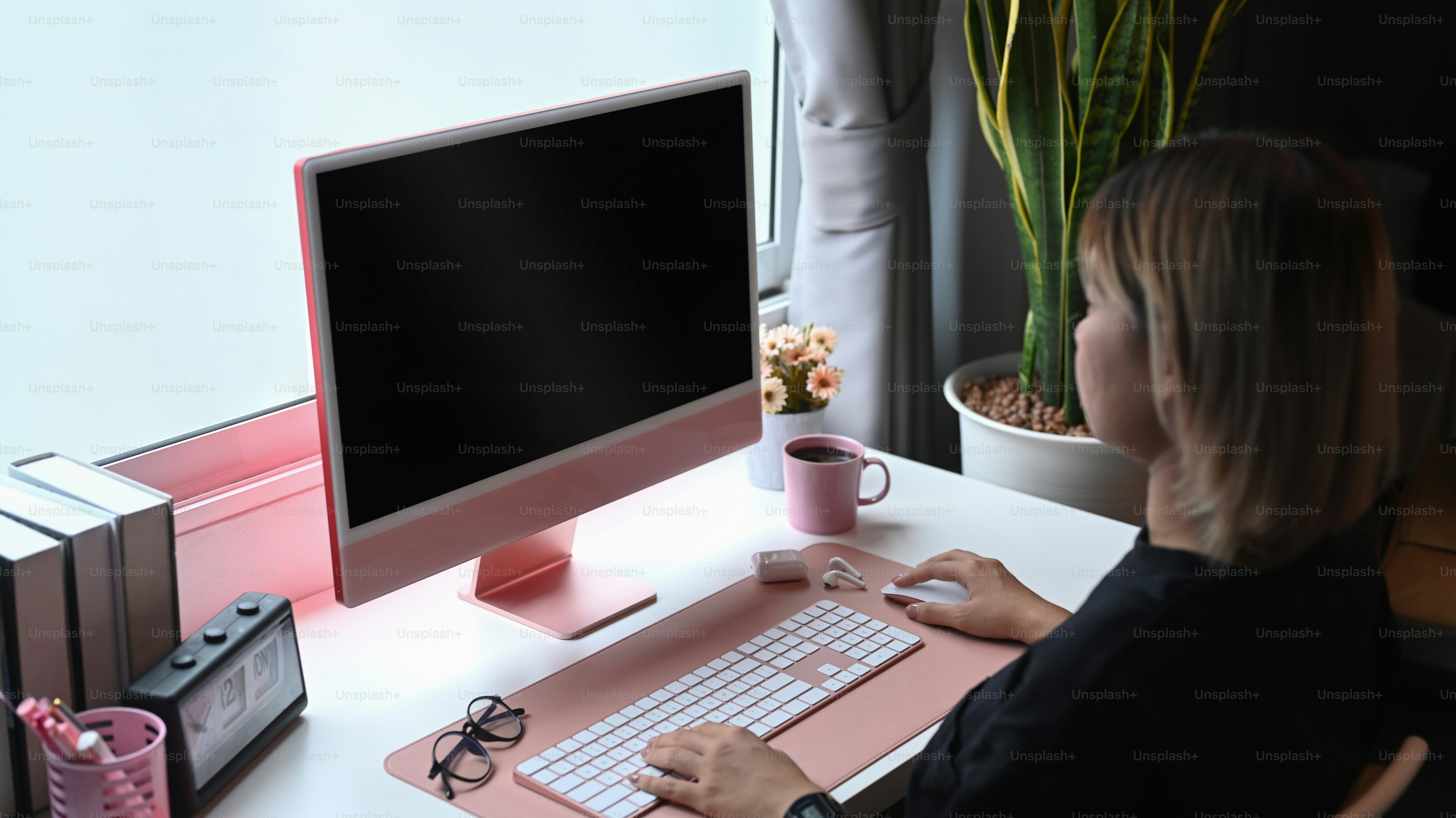 Side view Asian woman working online with computer at home.