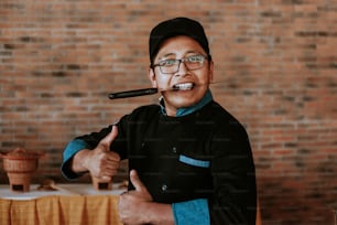 Young hispanic cook holding a knife in mexican restaurant in Mexico