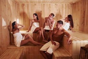 Group of young people together in sauna. Conception of vacation and weekend.