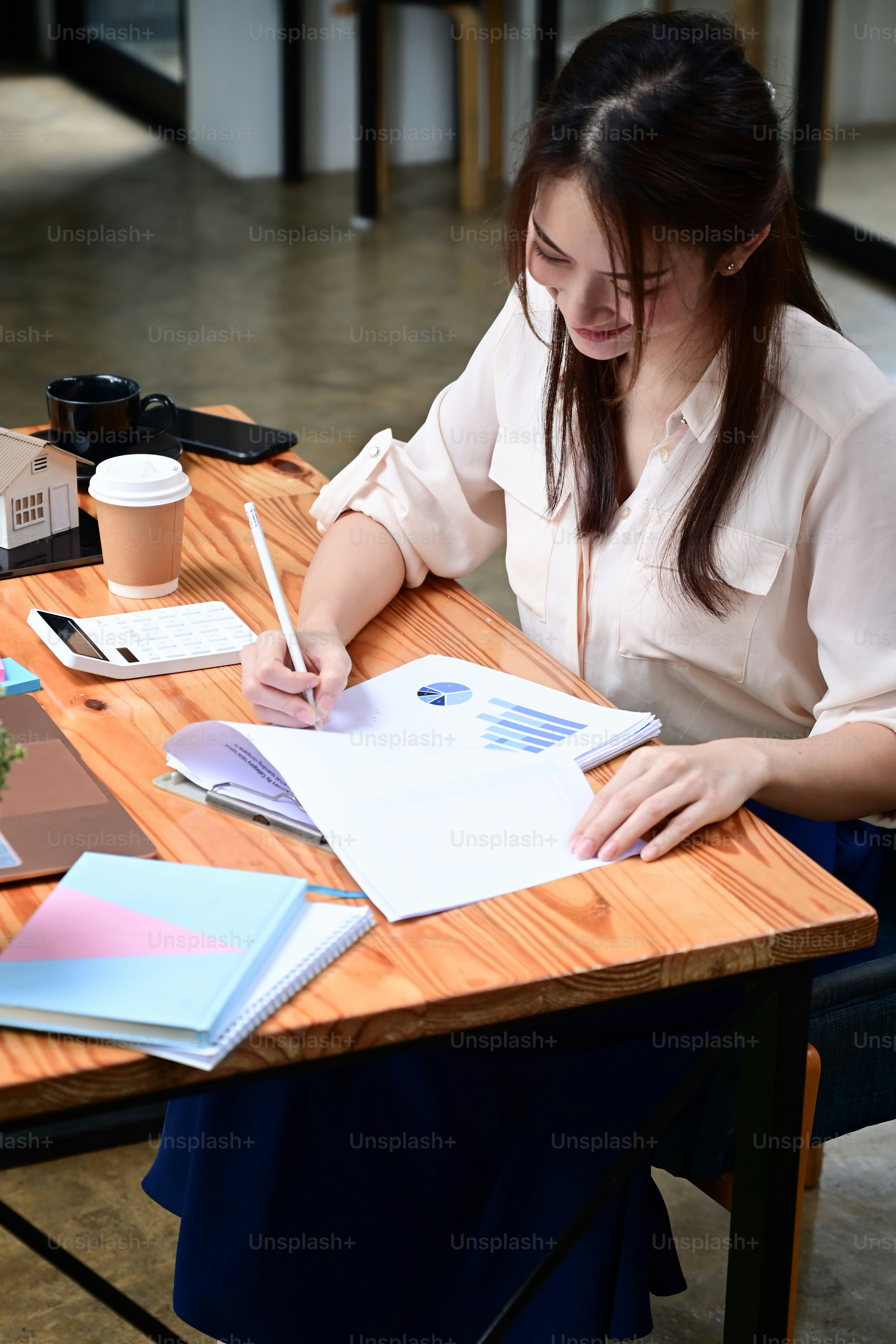 Accountant reviewing financial documents and calculating figures