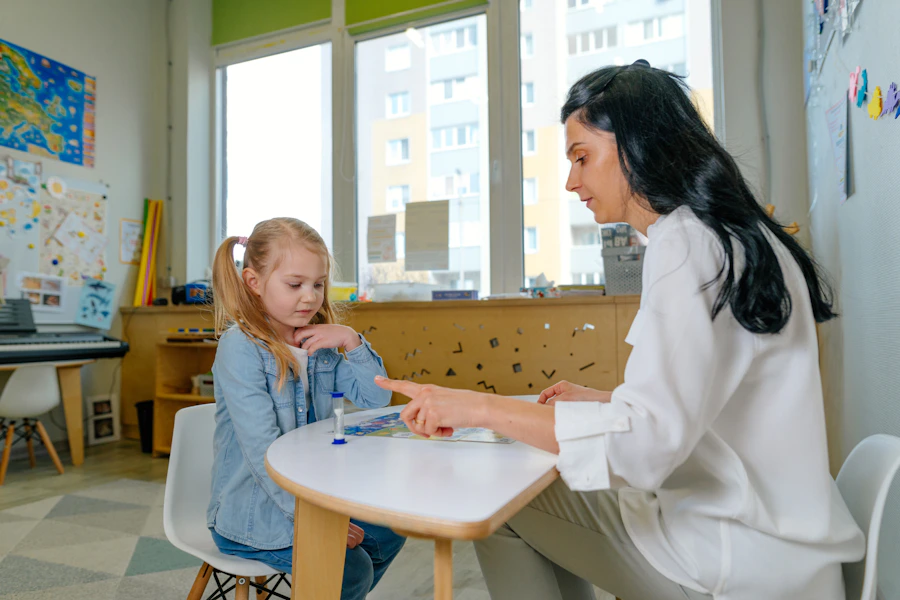 A speech and language therapist conducting a structured assessment with a young child using puzzle activities