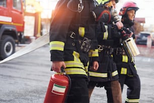 Group of firefighters in protective uniform that is on station.