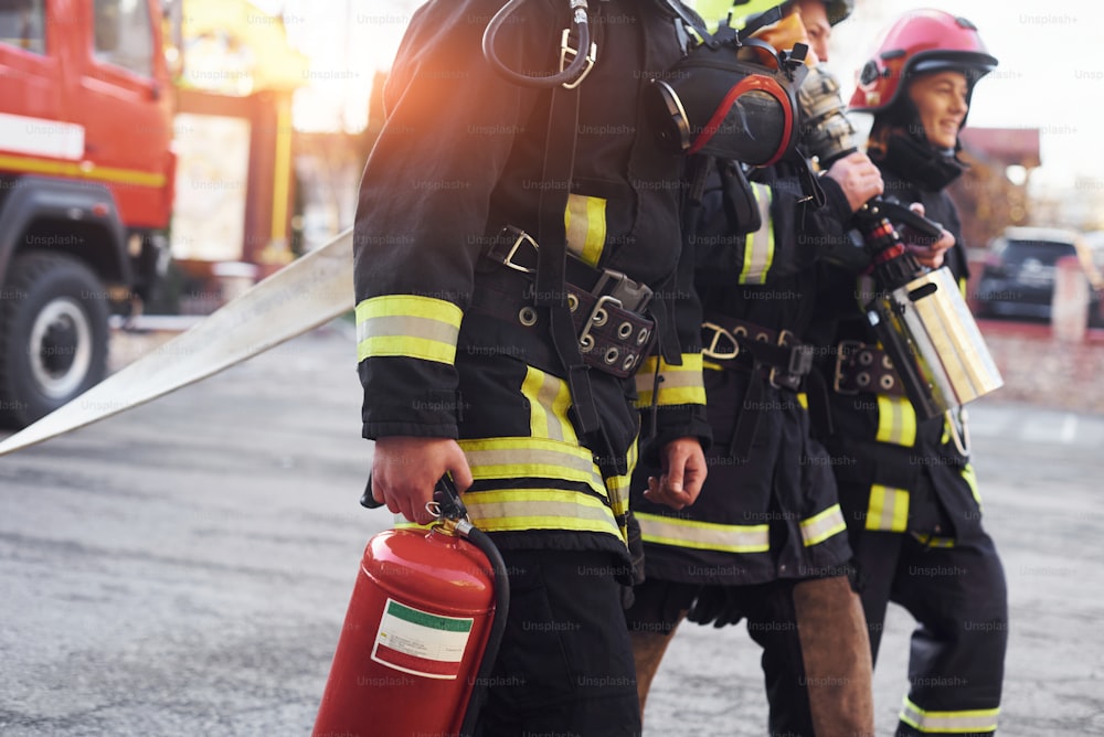 Group of firefighters in protective uniform that is on station.