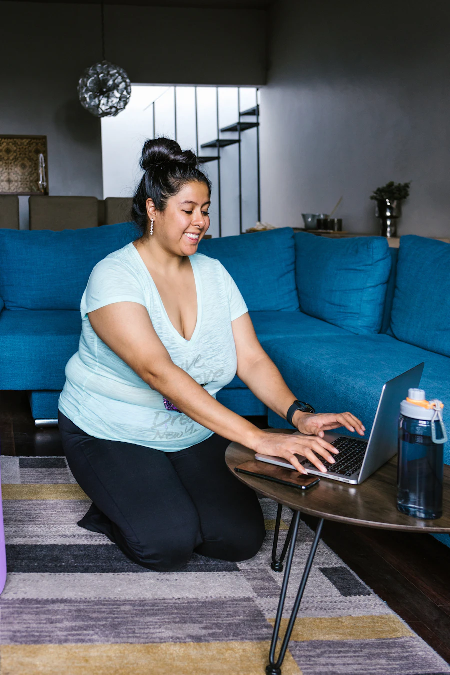 Woman at home using a laptop as part of her weight loss program
