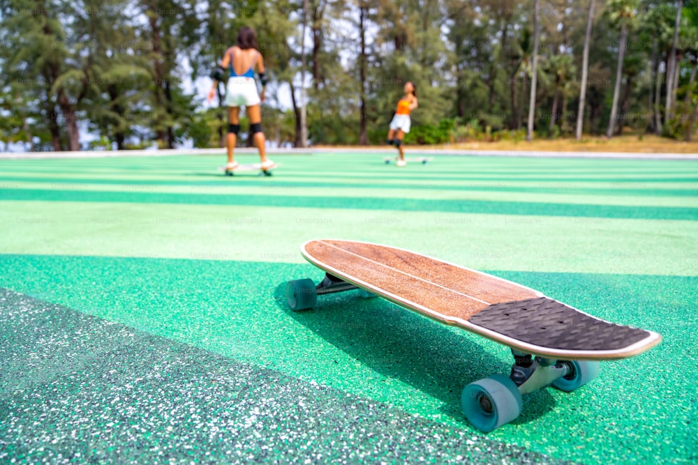 Skateboard on the floor at skateboard park in summer sunny day. Outdoor leisure activity lifestyle and extreme sport surf skate concept