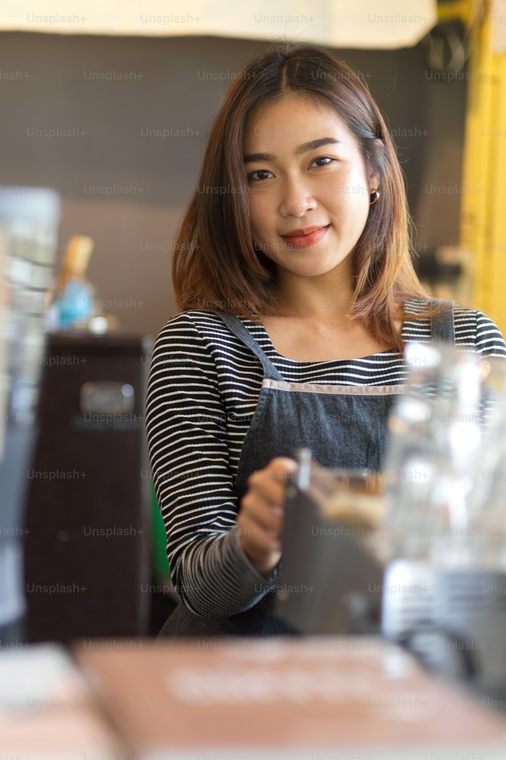 Portrait of Pretty young female barista smile to camera at coffee shop, cafe's staff, business owner