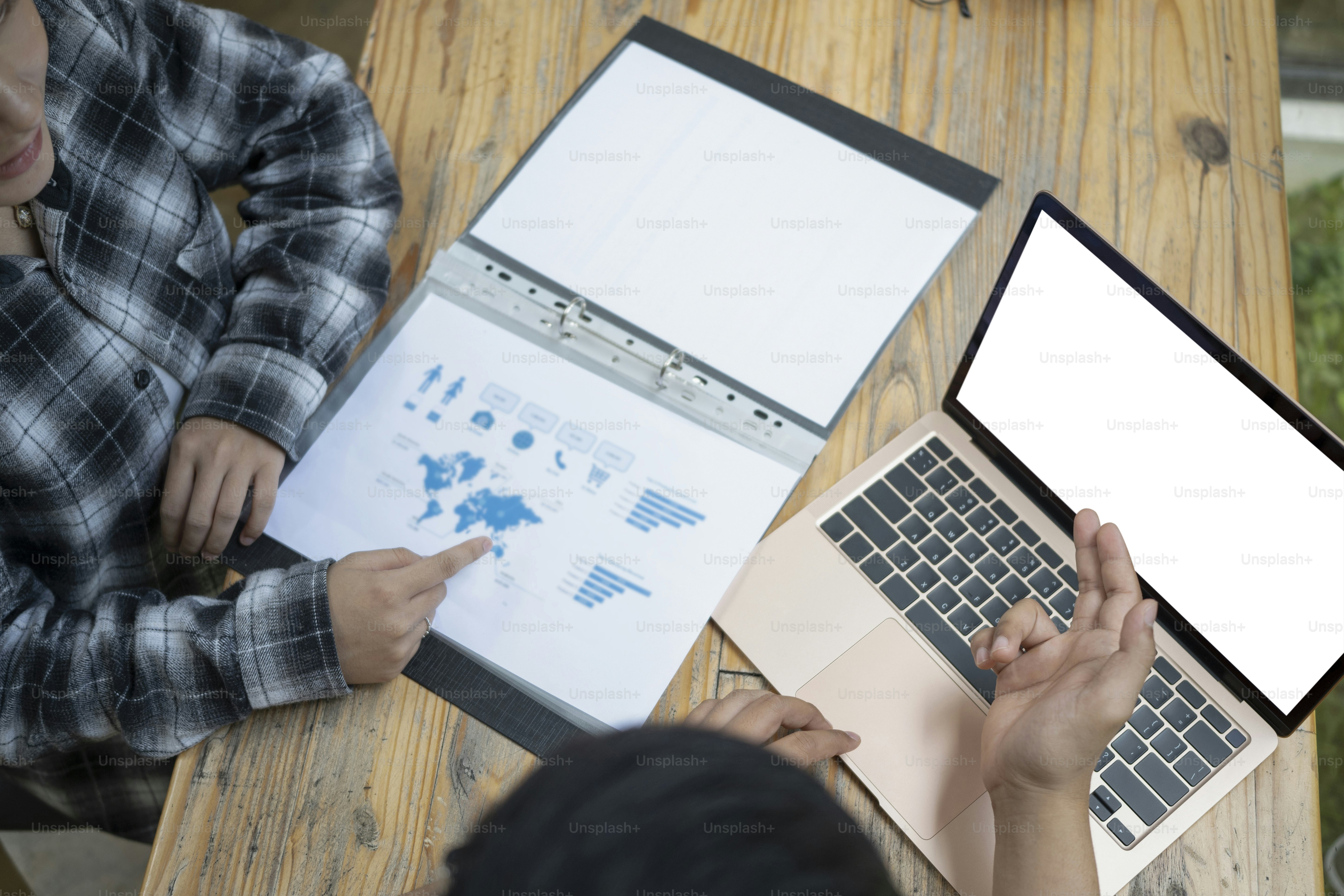 Business people analyzing financial data and working together with computer laptop.