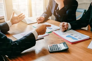 Meeting to discuss business investment. Businessman explaining something to a colleague during a business meeting.