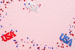 American Independence Day background with confetti and USA decorations. USA Labor Day, Memorial Day, US Veterans day concept. Flat lay, top view, copy space.