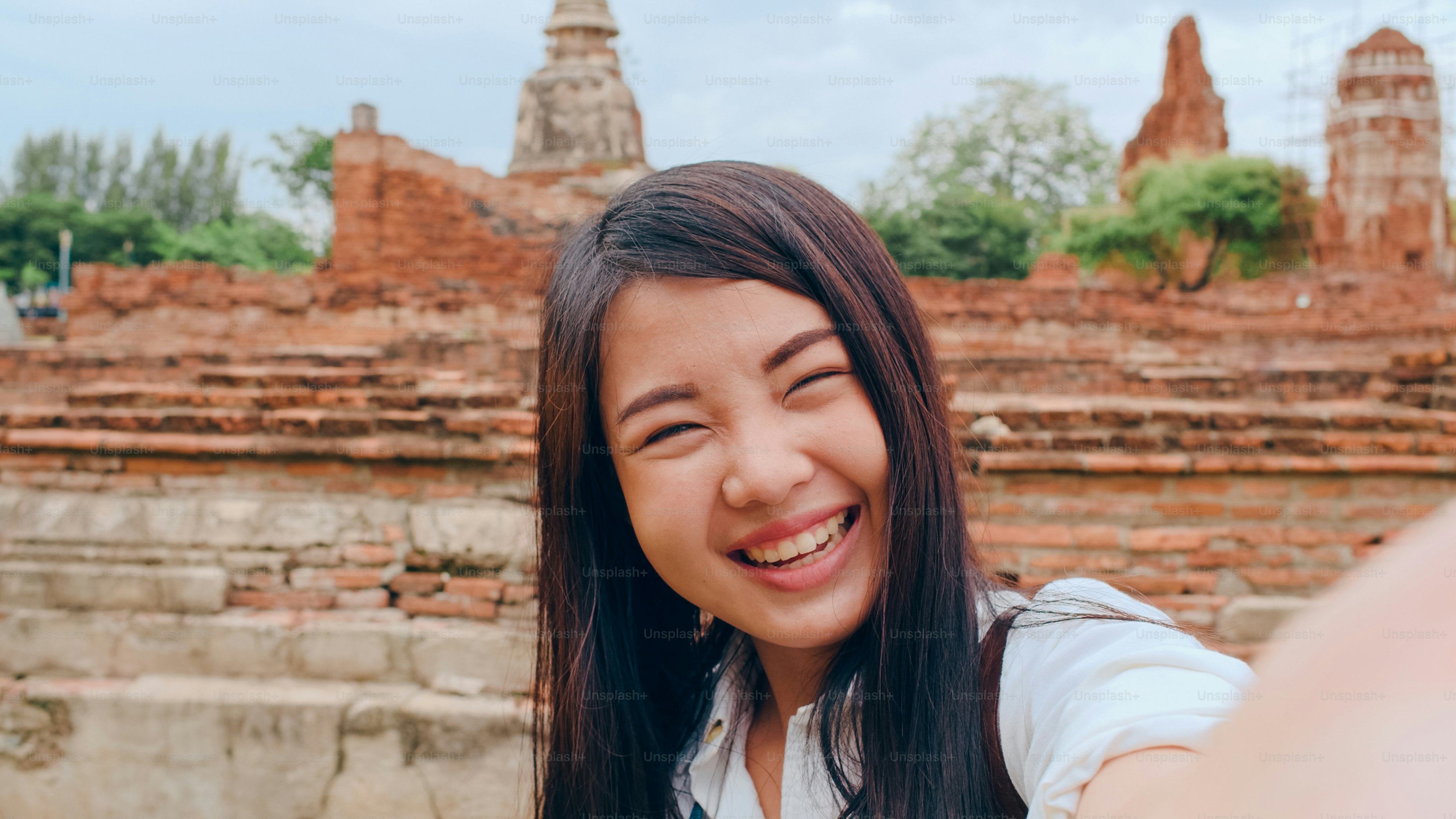 Close-up Young Asian backpacker blogger woman casual look camera video ...
