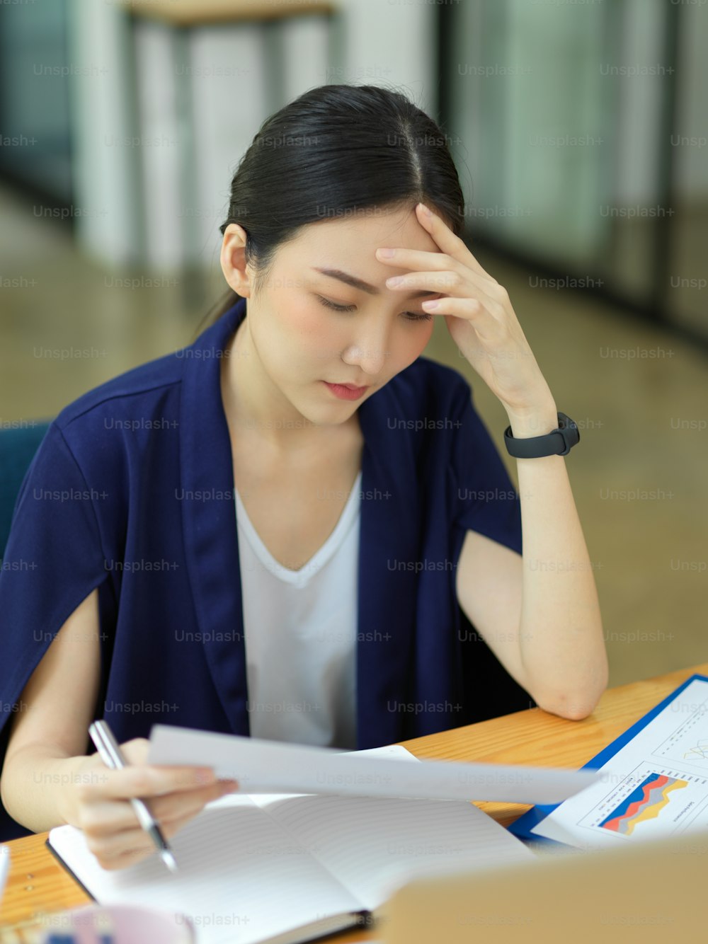 Portrait of Thoughtful businesswomen working on her desk in office and feel tired of work, headache, depression, tired to find solutions to fix business problems, stressed
