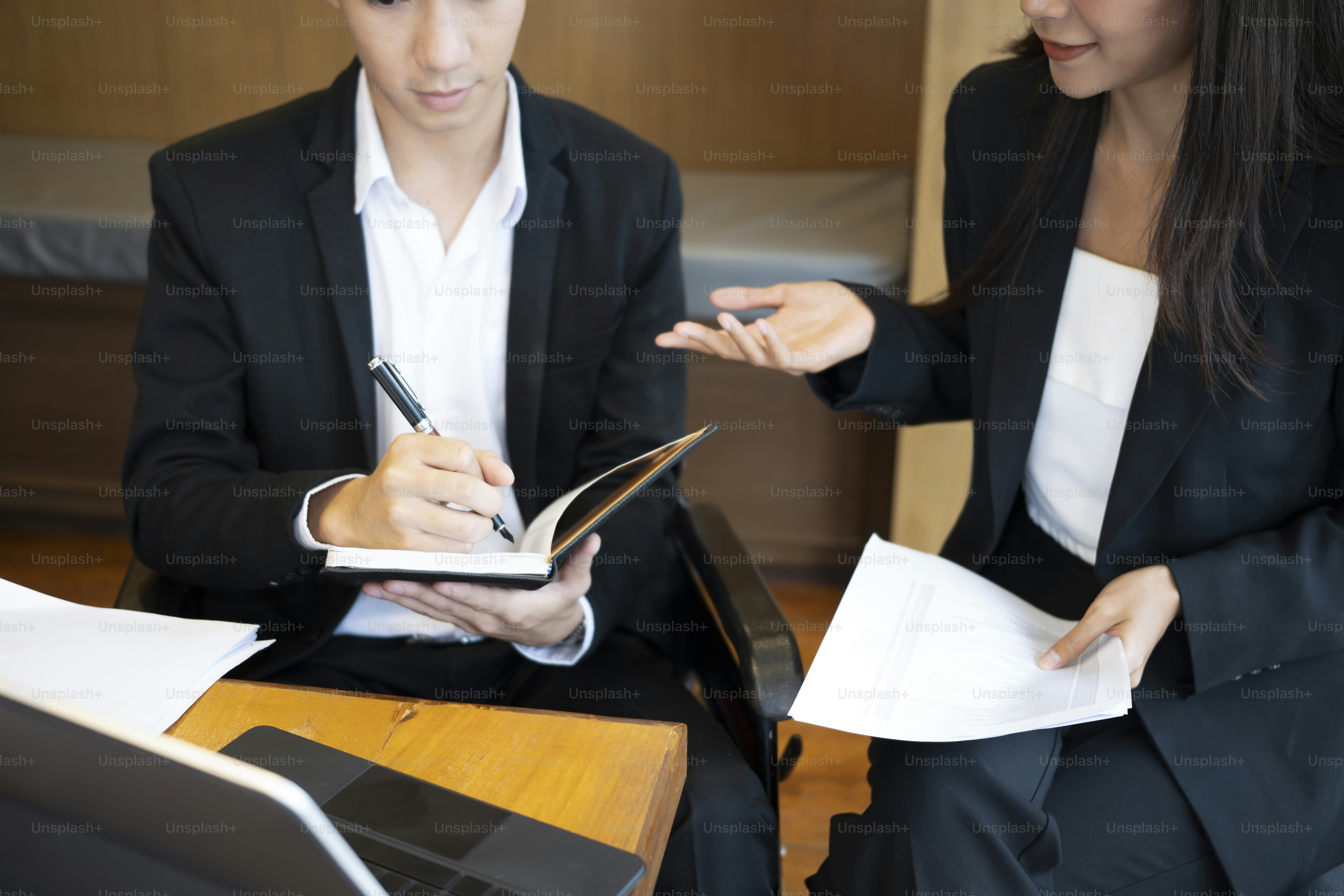 Handicapped male sitting with his colleagues in co working space.