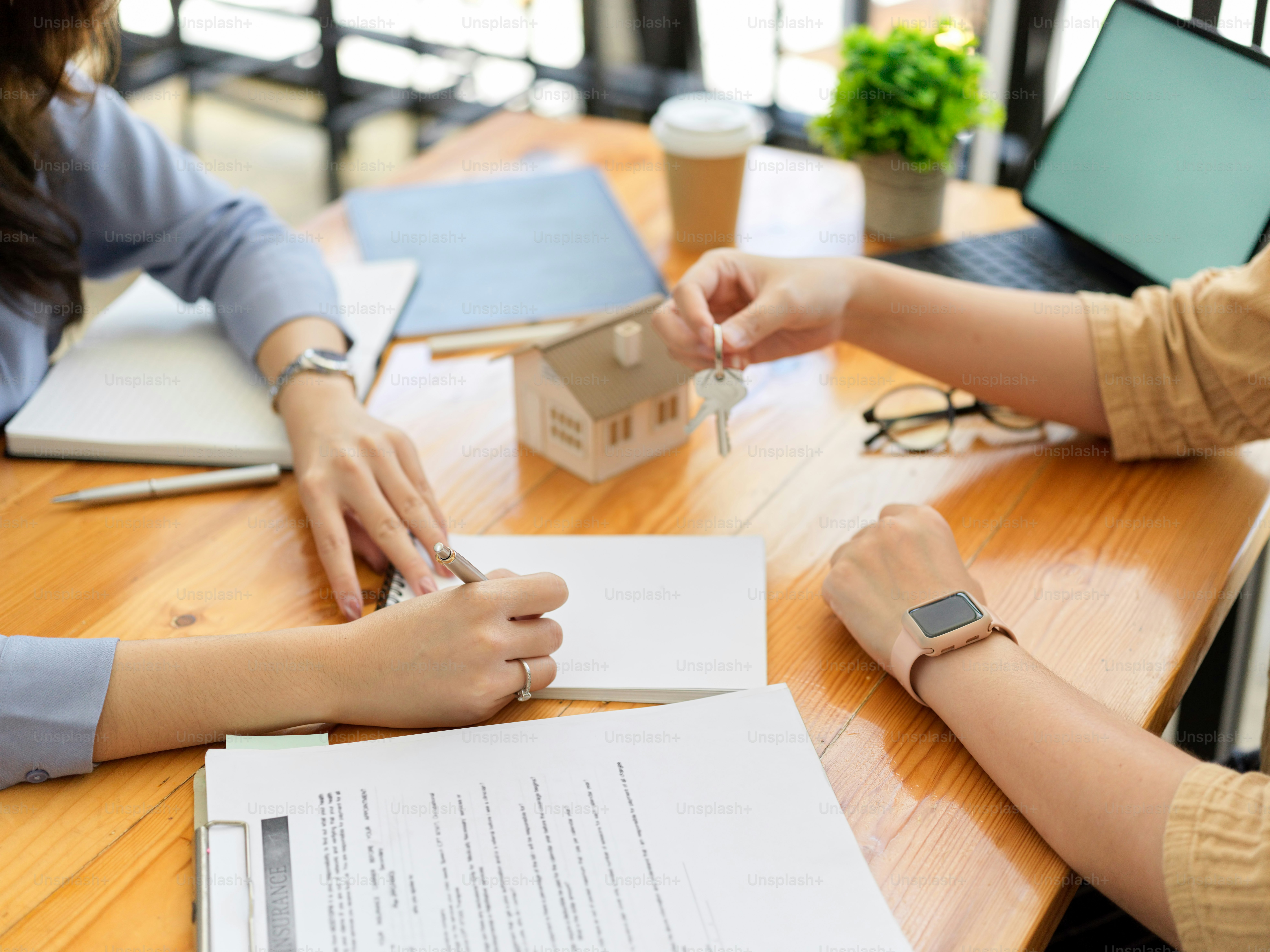 Closeup, Real estate agent negotiate with new tenant, making agreement and rental housing loan