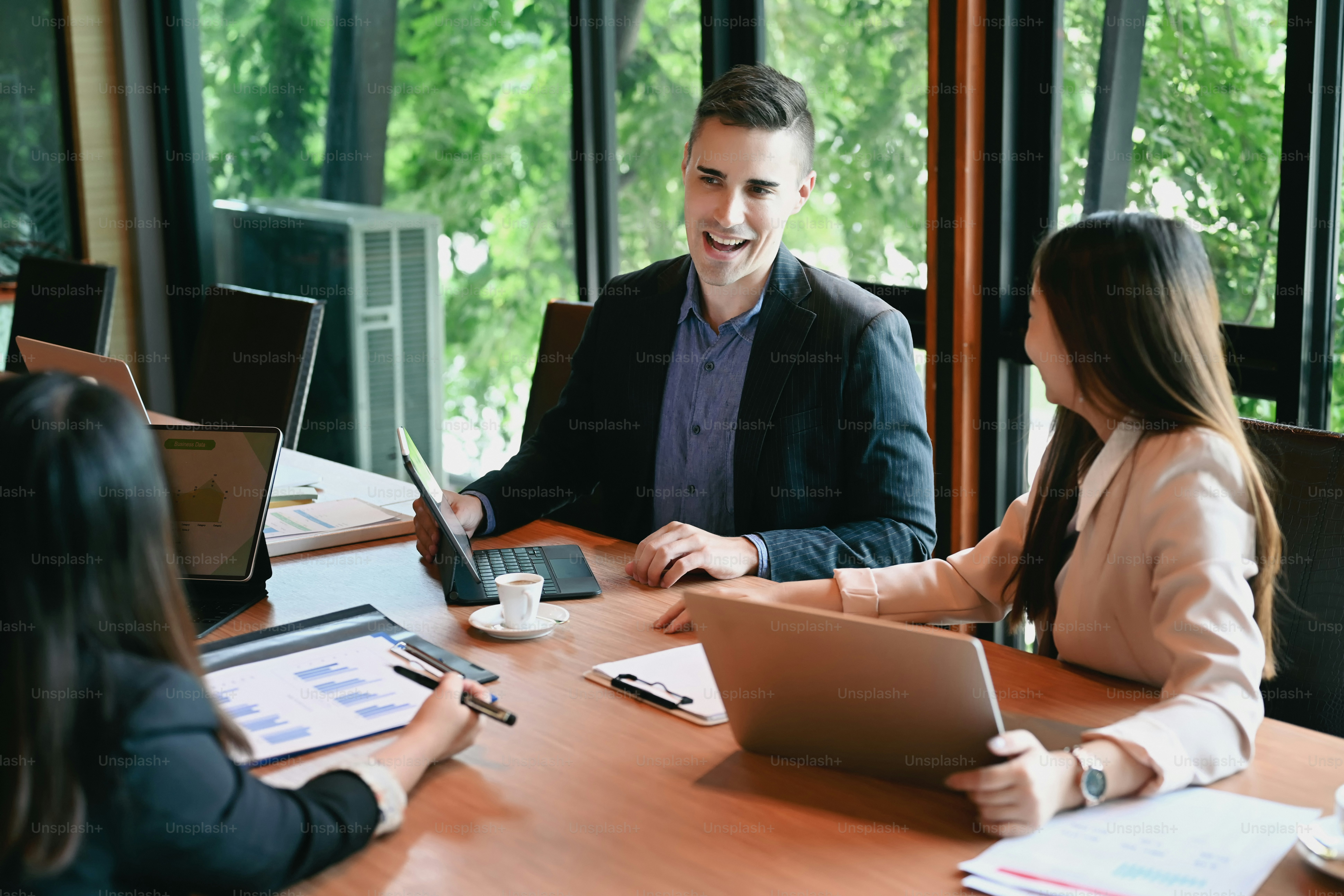 Confident male leader explaining business strategy with diverse ...