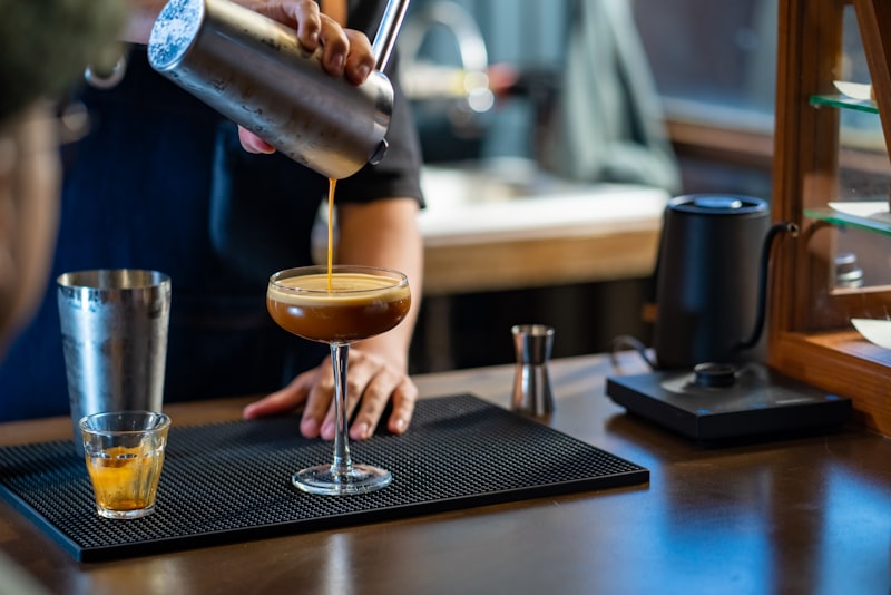 Barista pouring at bar counter