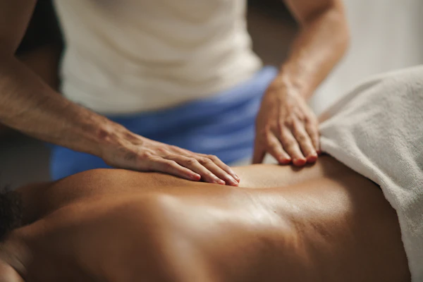 Woman receiving a relaxing back massage at a spa