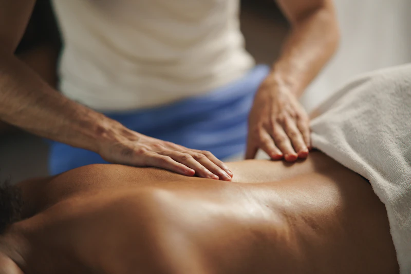 Woman receiving a relaxing back massage at a spa