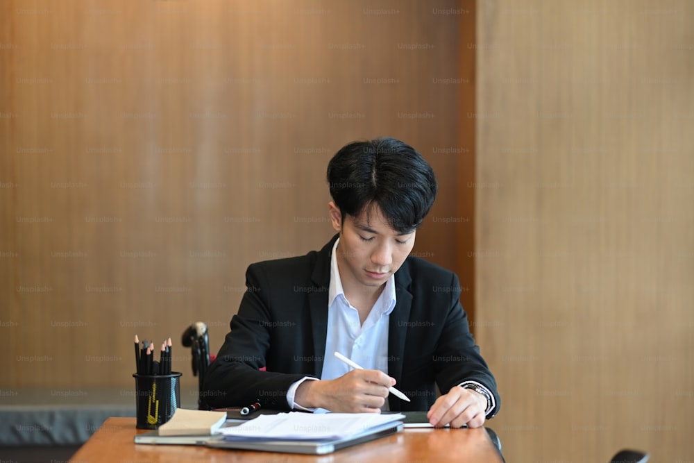 Handicapped man in wheelchair working in office.