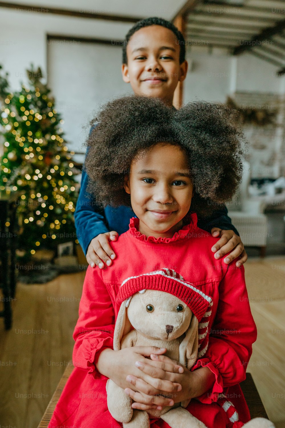 Sister and brother in the Chrismas time at home. Christmas time family leisure concept.