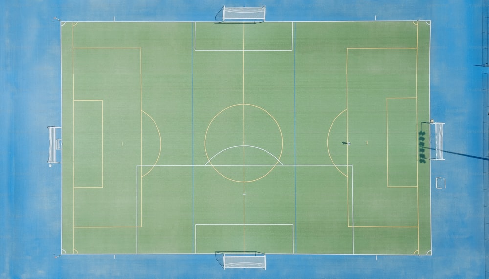 Aerial view of green grass for soccer field create sport game