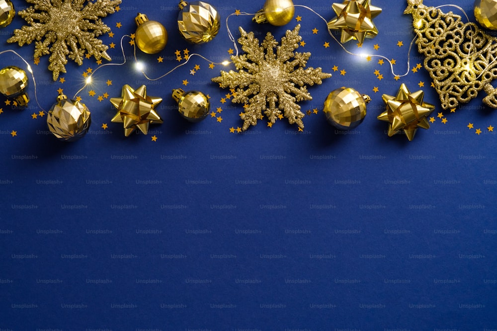 Elegant Blue Christmas background with golden balls and decorations. Christmas holiday celebration, winter, New Year concept. Christmas banner mockup, greeting card template