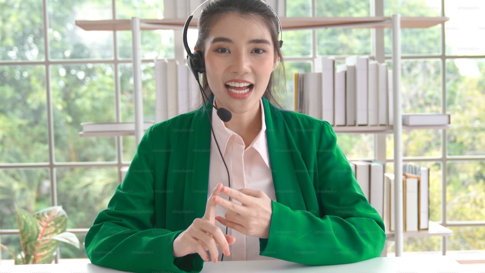 Video call camera view of businesswoman talks actively in videoconference . Call center, telemarketing, customer support agent provide service on telephone video conference call.