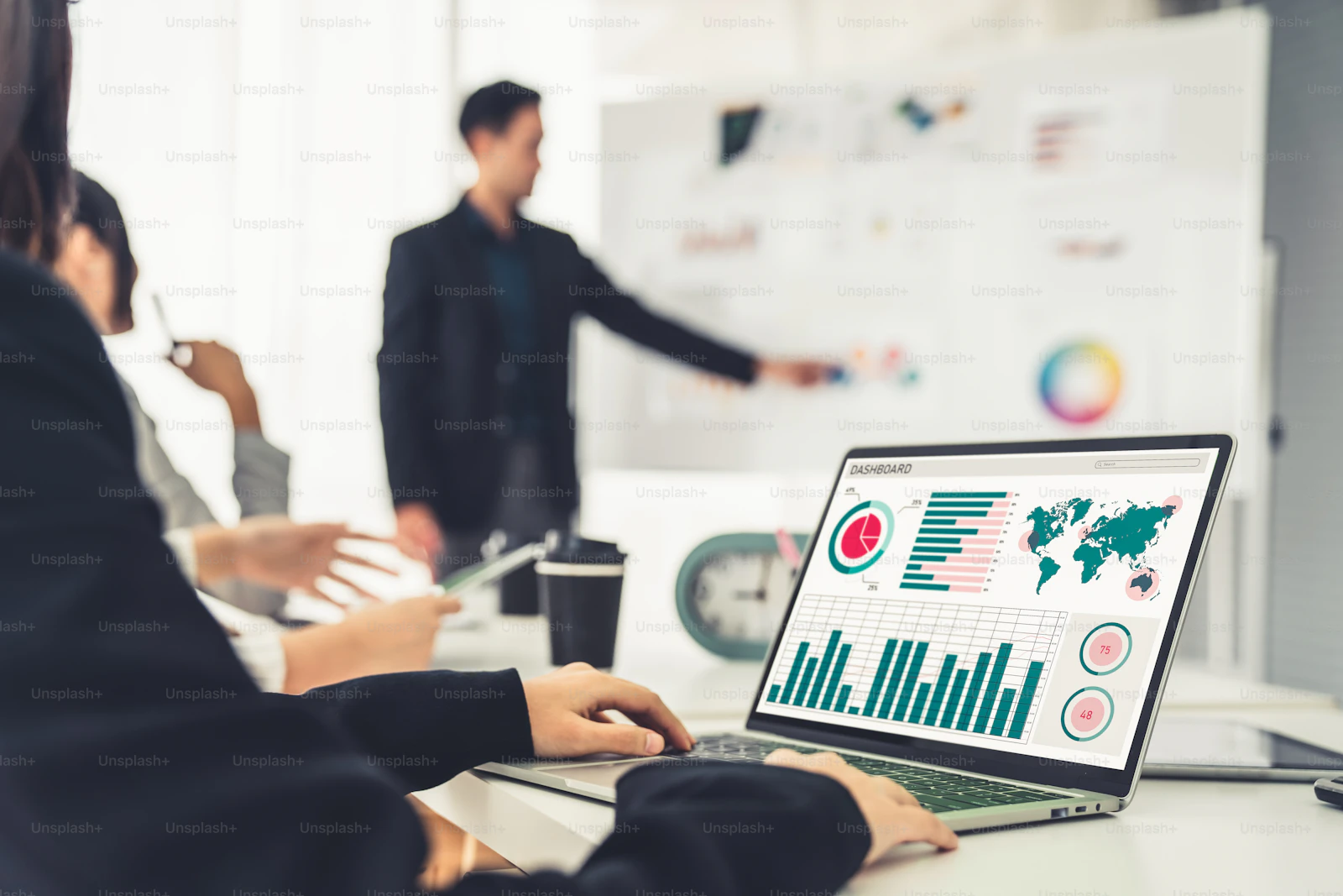 Analysts reviewing data on a shared screen
