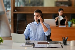 Businessman calling to his business partner company to remind the conference meeting date. male broker on the phone with client.