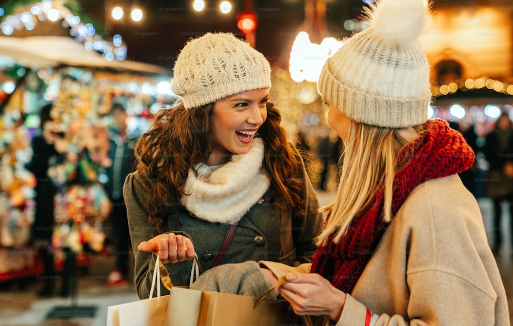 Portrait of cheerful young happy woman doing Christmas shopping. Christmas sale people concept