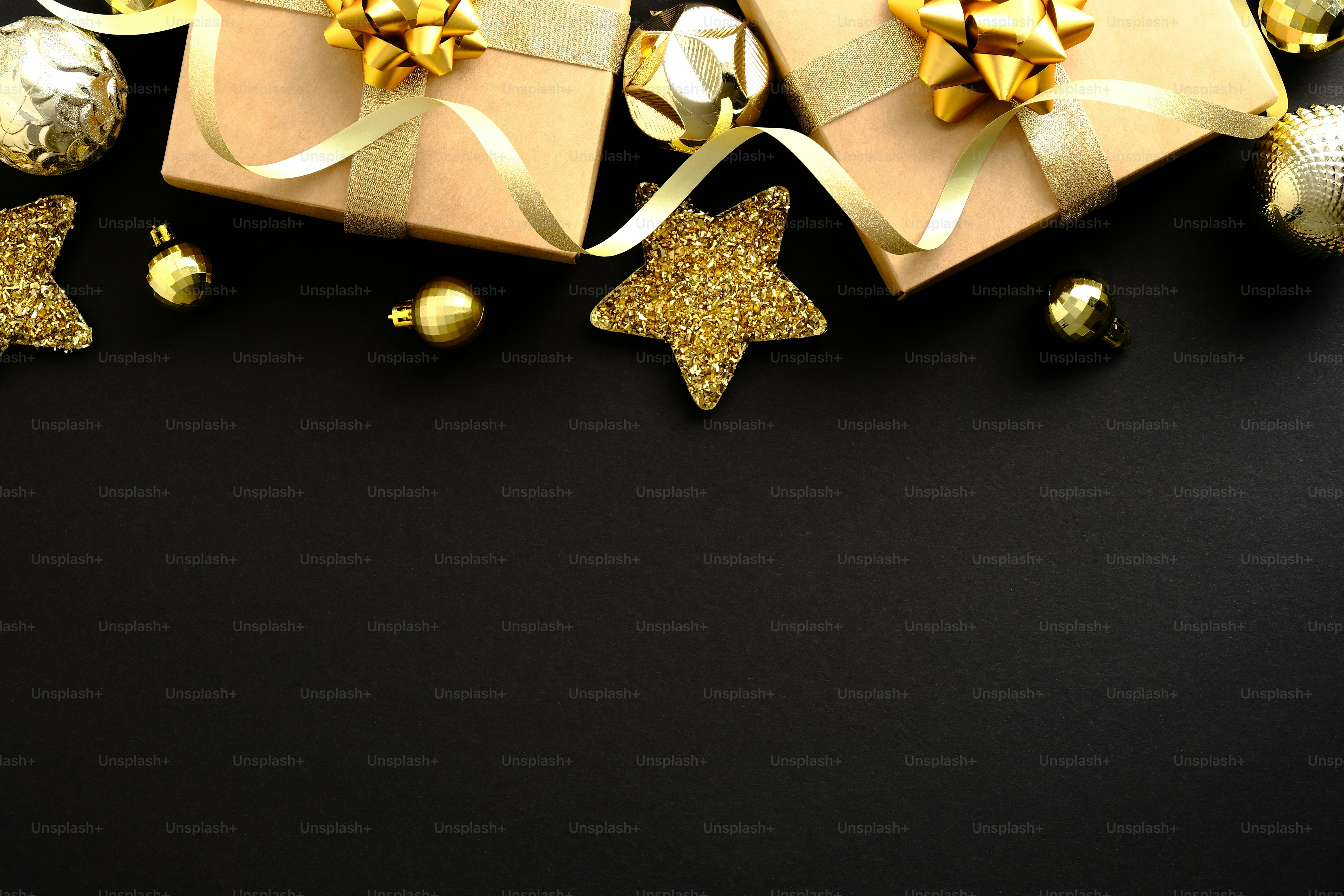 Black Christmas background with gift boxes and festive Xmas decorations ...