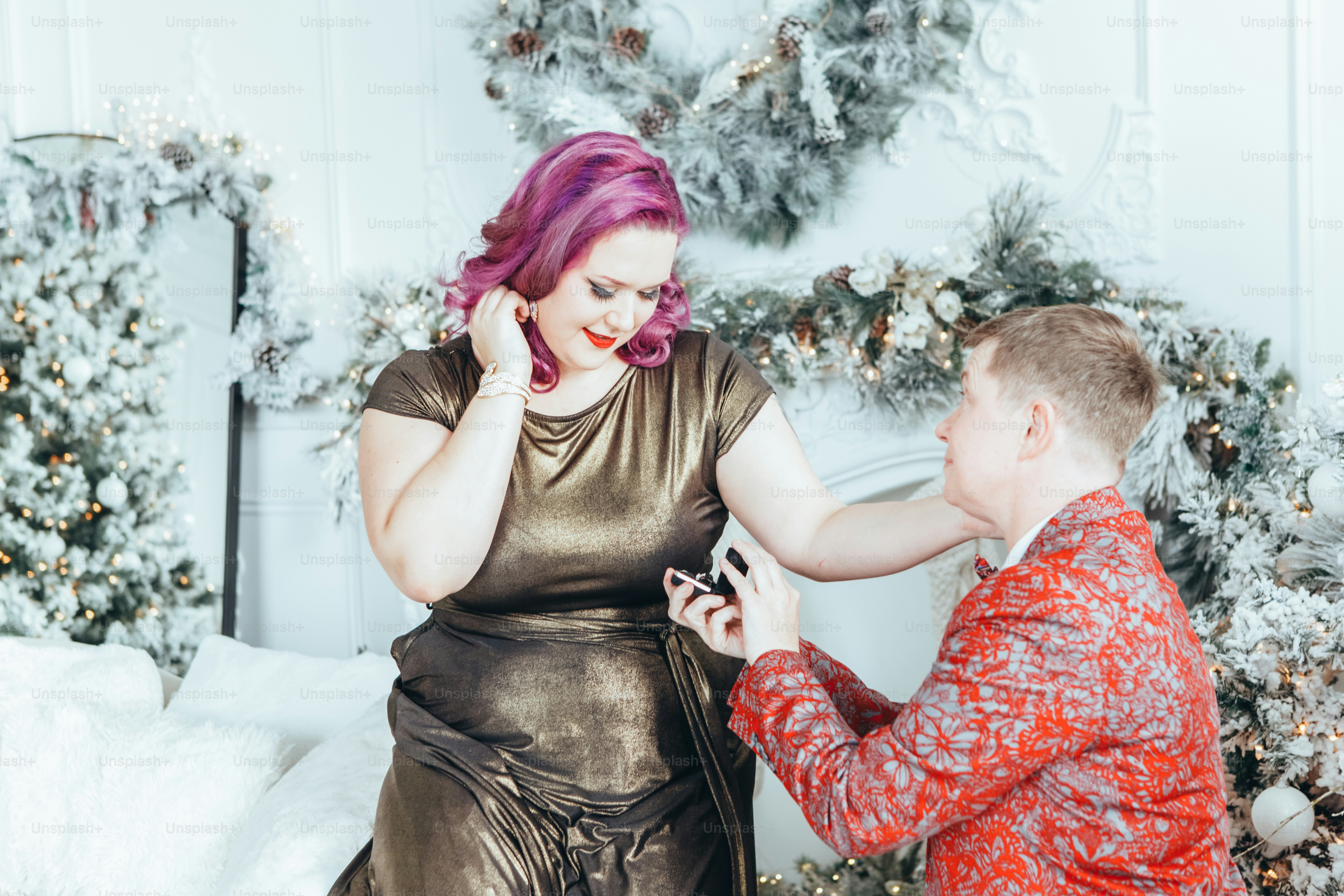 Homosexual gay butch woman proposing her girlfriend to marry her and giving her box with ring. LGBTQ lesbian couple celebrating Christmas or New Year winter holiday. Real authentic positive emotion