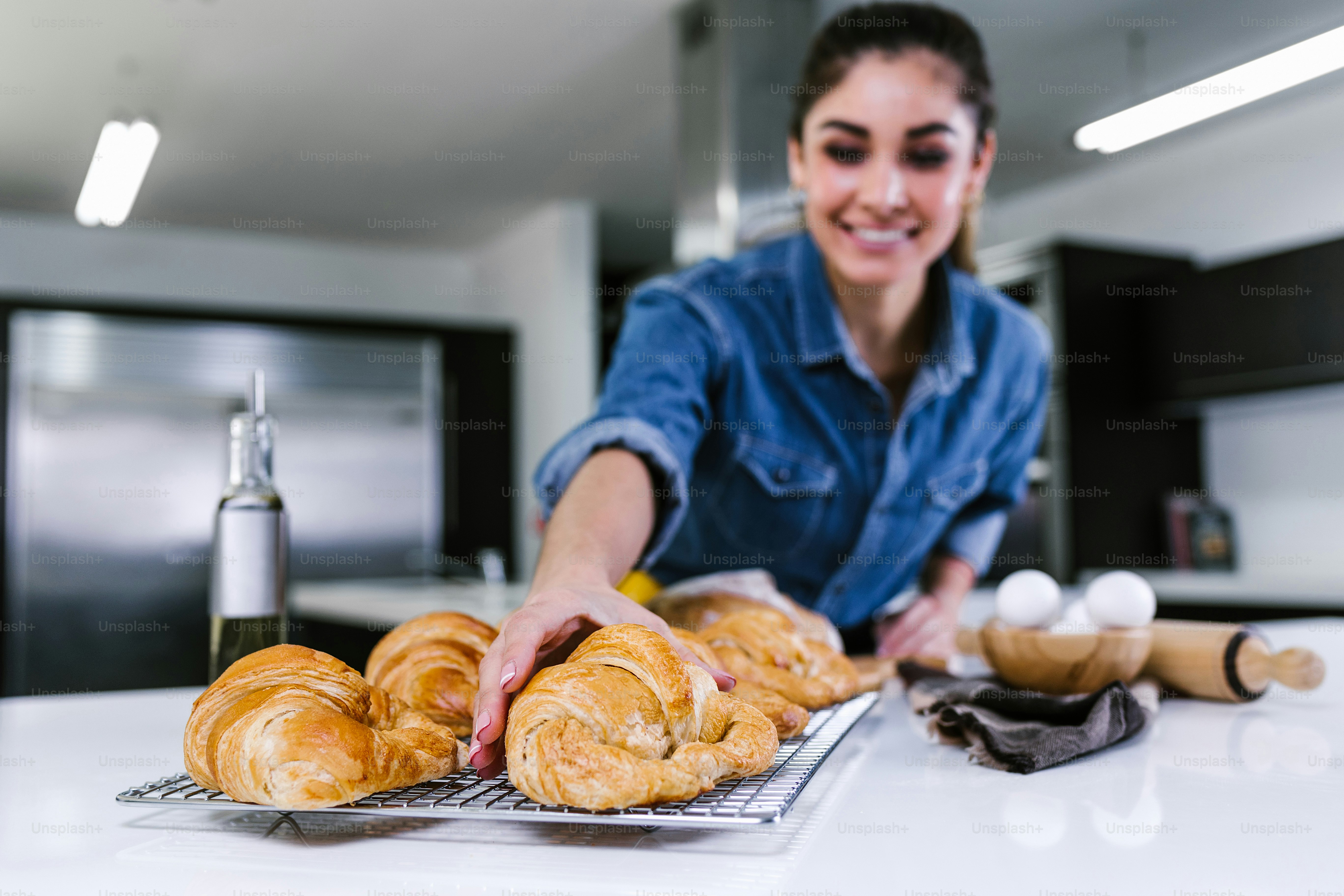 young Latin woman baking croissant ingredients in kitchen in Mexico Latin America