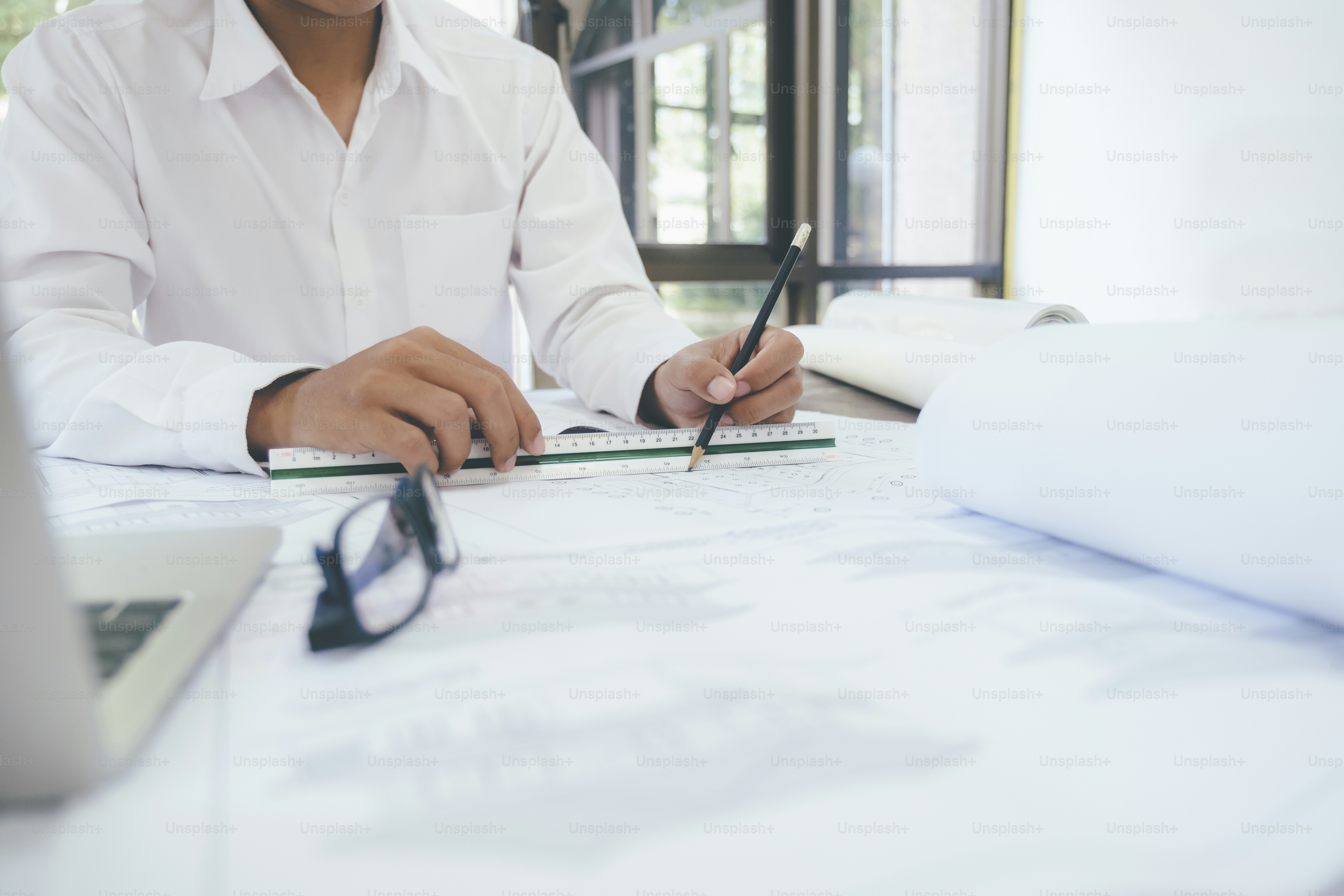 Construction plans and calculator on table