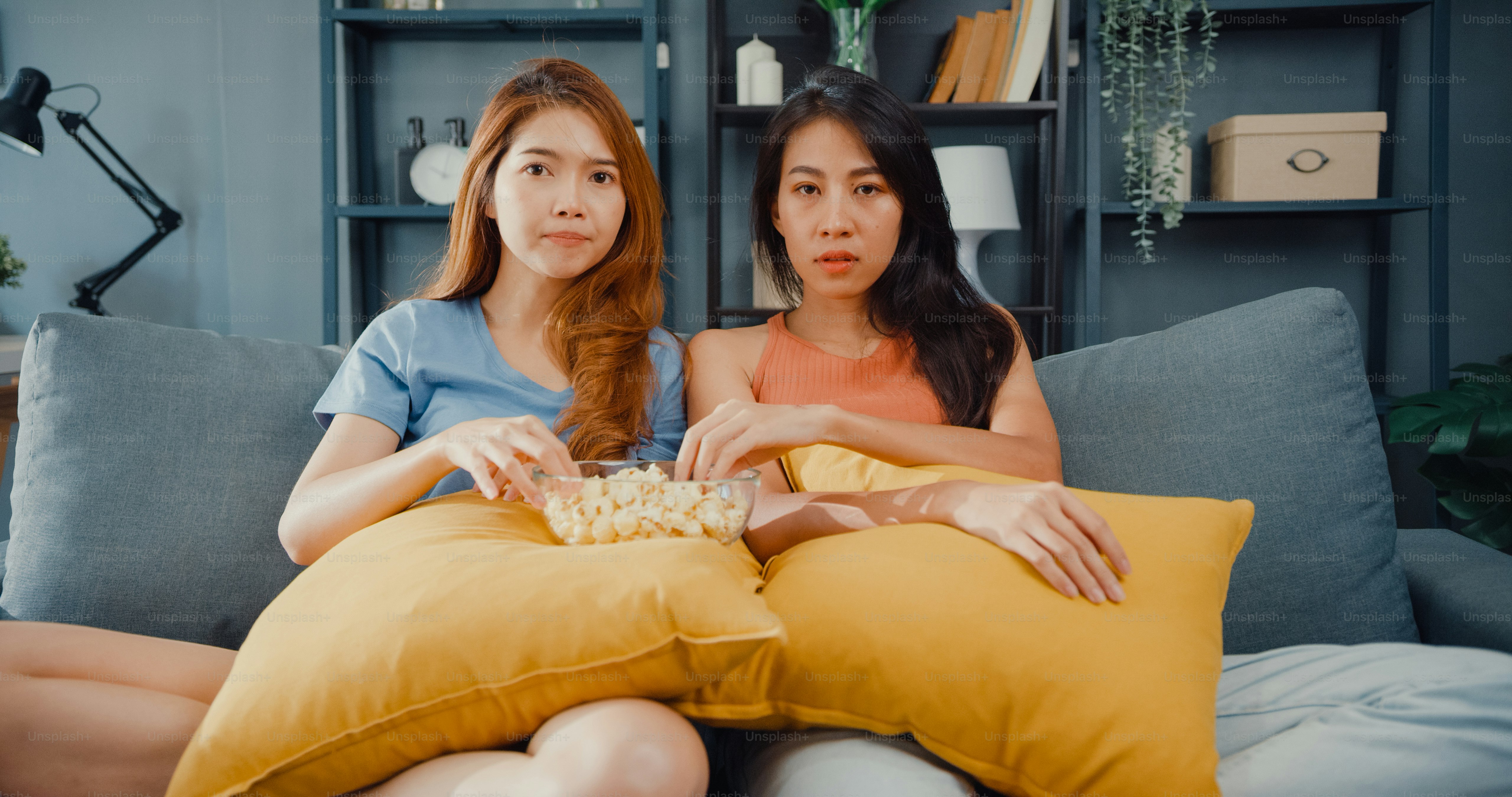Attractive Asia lovely couple lady positive glad cheerful with casual have fun and enjoy moment watch online movie entertainment on couch in living room at home.