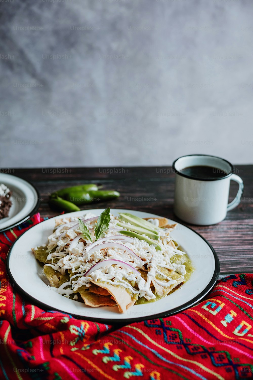 mexican green chilaquiles with chicken and spicy green sauce traditional breakfast in Mexico