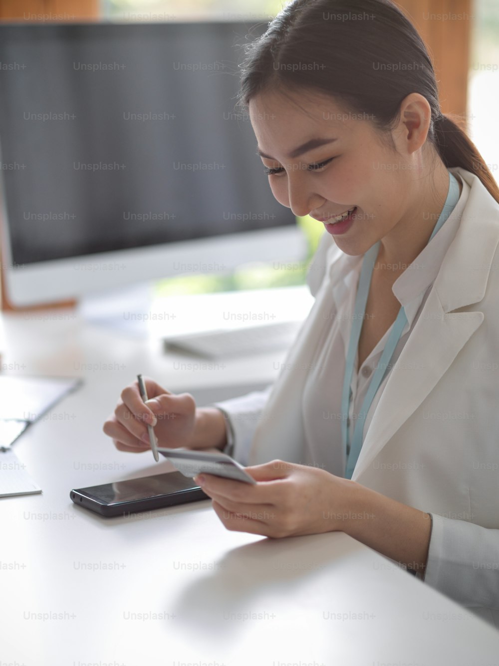 A portrait of a beautiful business woman checking her payroll on a mobile banking application. A woman is making a purchase and paying for it online. electronic wallet concept.