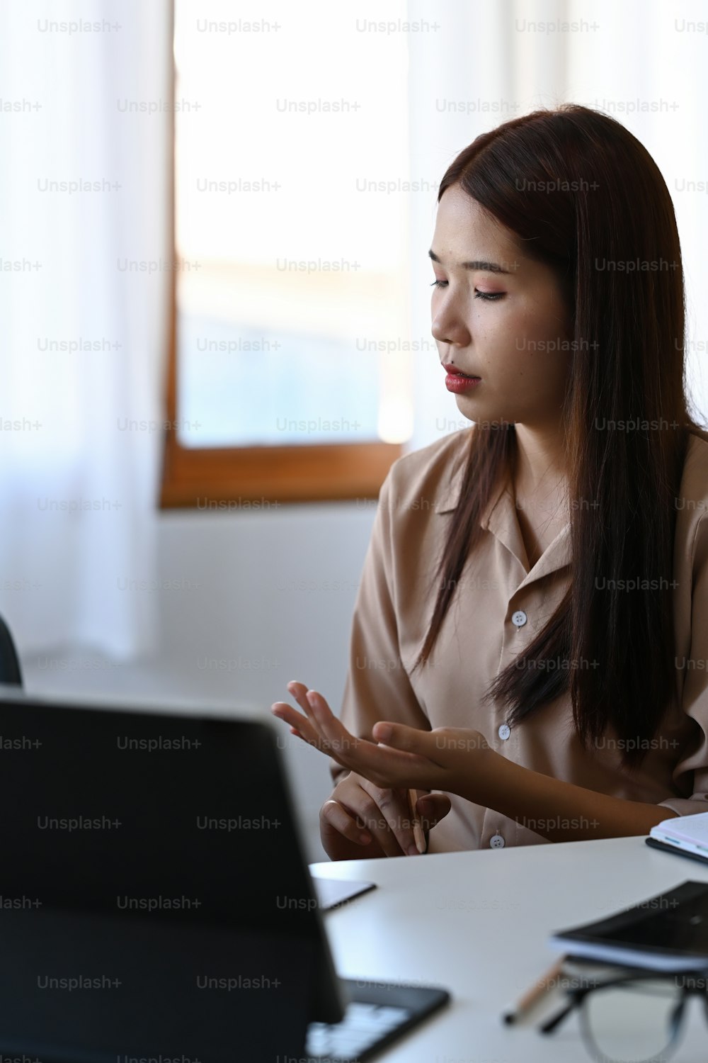Young businesswoman having meeting in modern office.