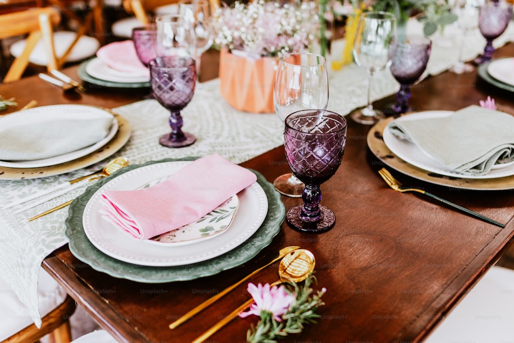 table setup with flowers, glasses and plates on table decorated for Wedding Reception in terrace Latin America