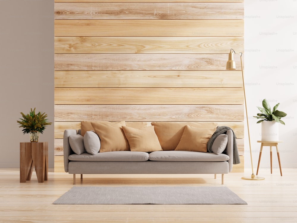 Sofá en una habitación vacía moderna detrás de la pared de madera.Representación 3D