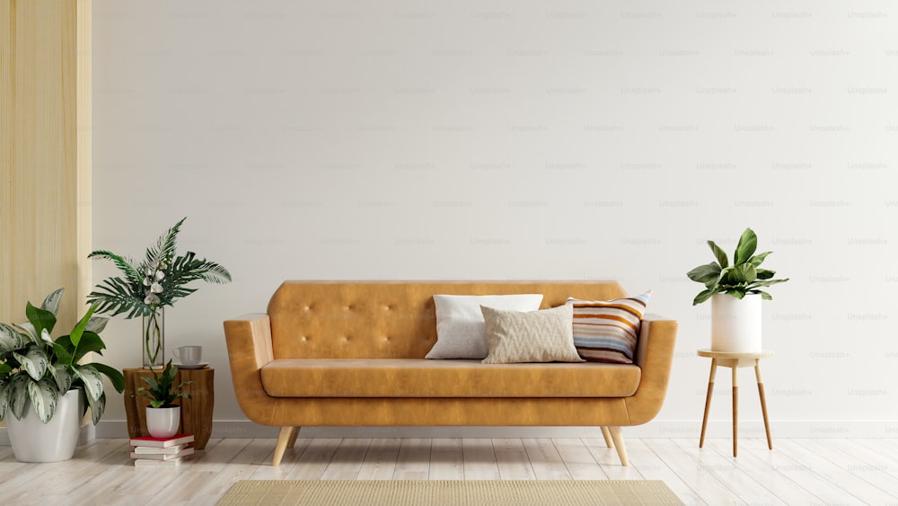 El interior con sofá de cuero sobre fondo de pared blanco vacío renderizado .3d